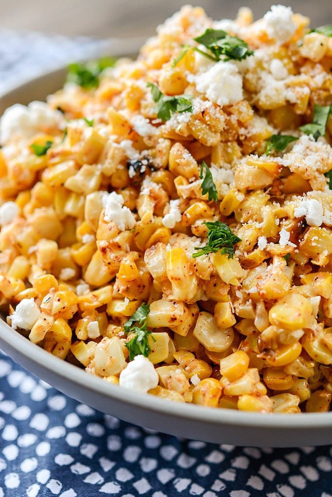 gray bowl filled with Mexican Street Corn Salad