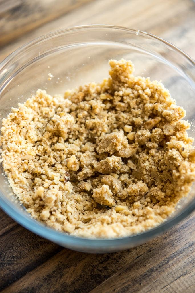 Crushed walnuts in mixing bowl for Mini Pumpkin Pies