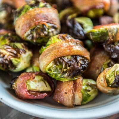 Air Fryer Bacon Wrapped Brussels sprouts in a gray bowl