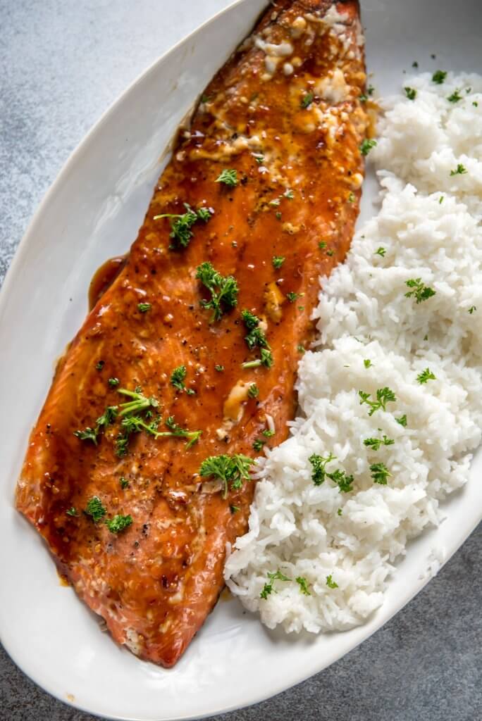 Korean BBQ Grilled Salmon on white serving platter with steamed rice