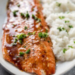 Korean BBQ Grilled Salmon on white serving platter with steamed rice