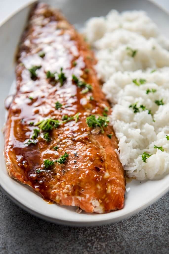 Korean BBQ Grilled Salmon on white serving platter with steamed rice