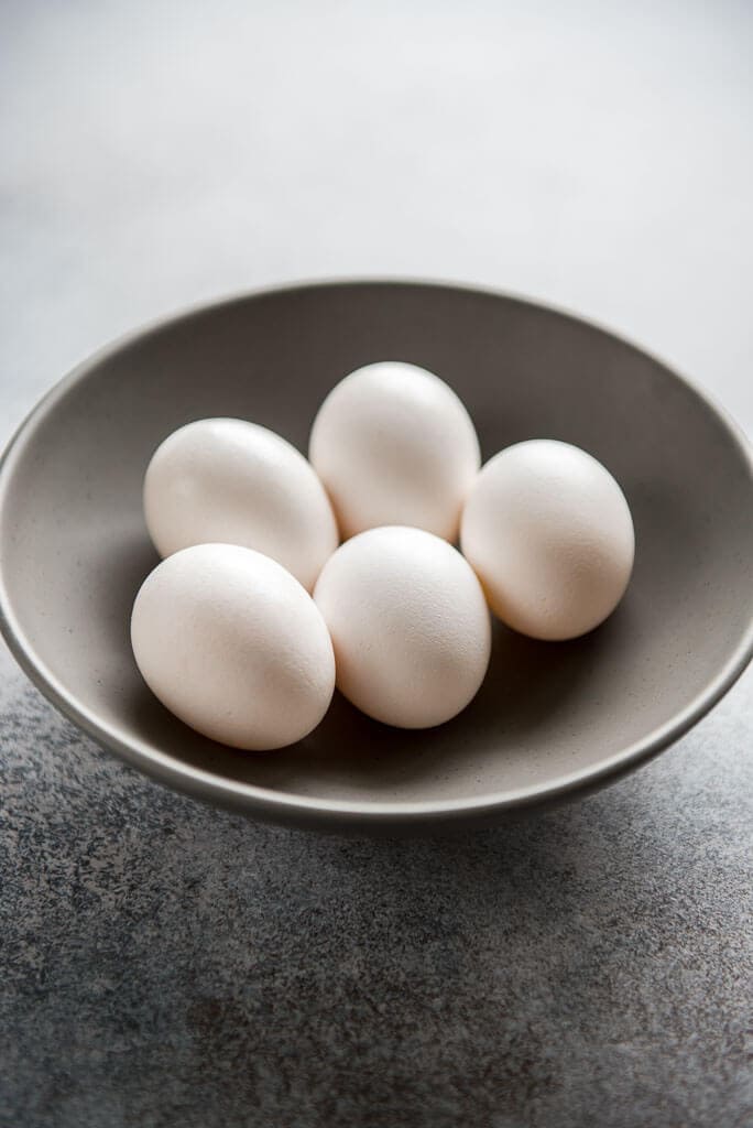 uncracked eggs in gray bowl for Instant Pot Sous Vide Egg Bites