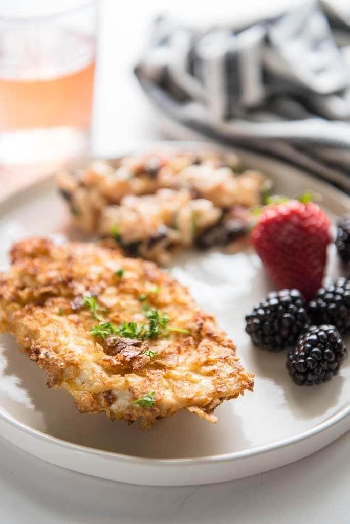 air fryer potato chip chicken on white plate with berries