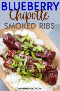 These Blueberry Chipotle Smoked Ribs are the most flavorful ribs you will eat all summer! Perfect for a BBQ party or a family dinner with a sweet spicy kick of flavor for these boneless beef ribs. #garnishedplate #grillrecipe #ribs #smokedribs #bbq
