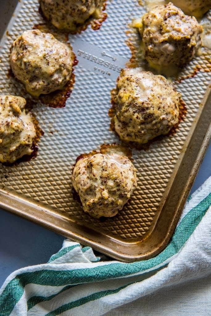 baked turkey meatballs on a cookie sheet