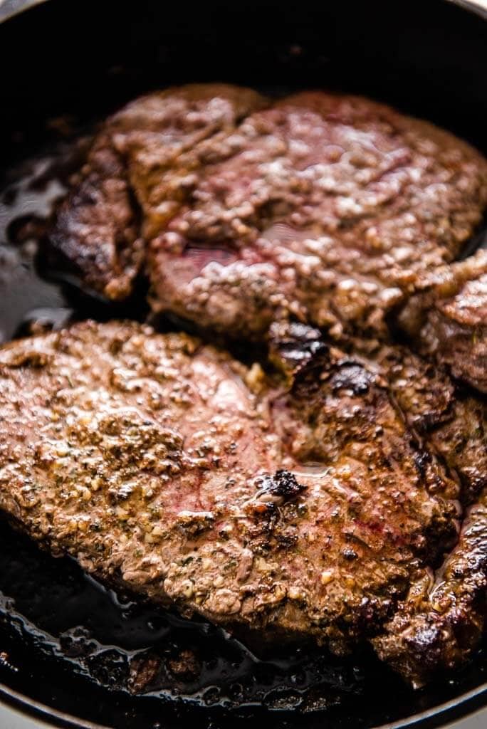 ribeye steak in cast iron skillet