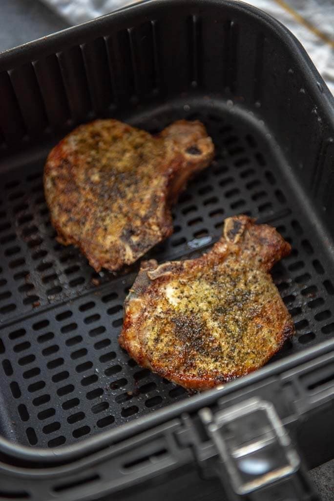 herb crusted pork chops in air fryer basket