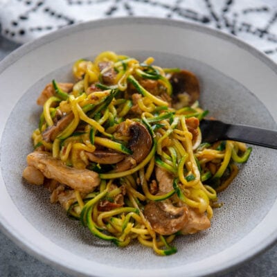 pork lo mein with zucchini noodles in bowl