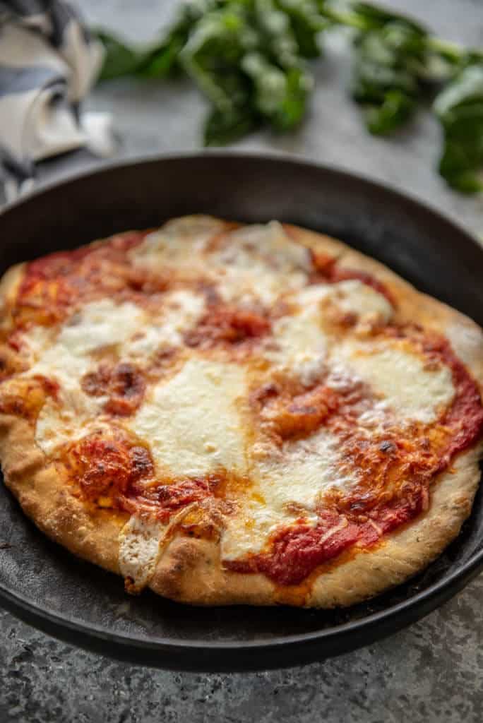 margherita pizza in a cast iron skillet