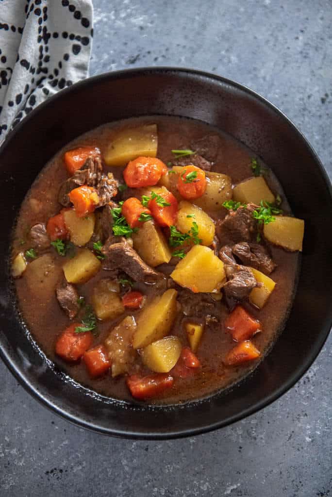 beef stew in black bowl