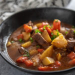 instant pot beef stew in black bowl