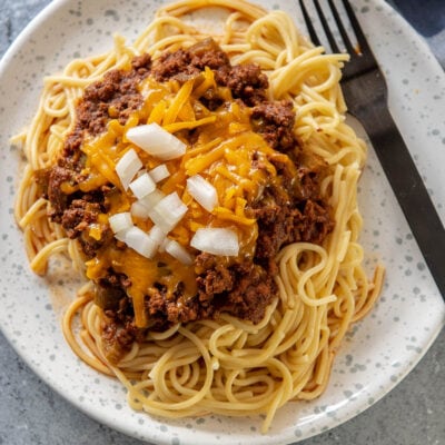 spaghetti noodles topped with Cincinnati chili on plate
