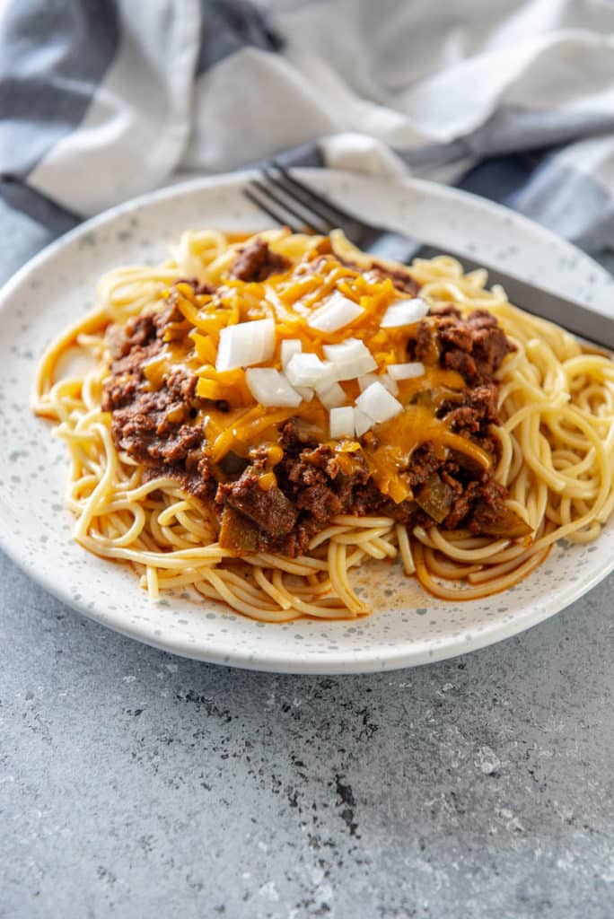 spaghetti noodles topped with Cincinnati chili on plate