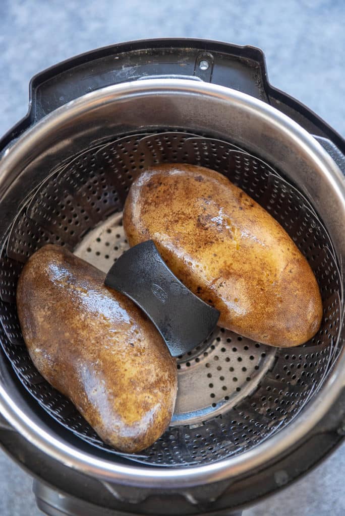 How to Make Baked Potatoes in an Instant Pot - Garnished Plate