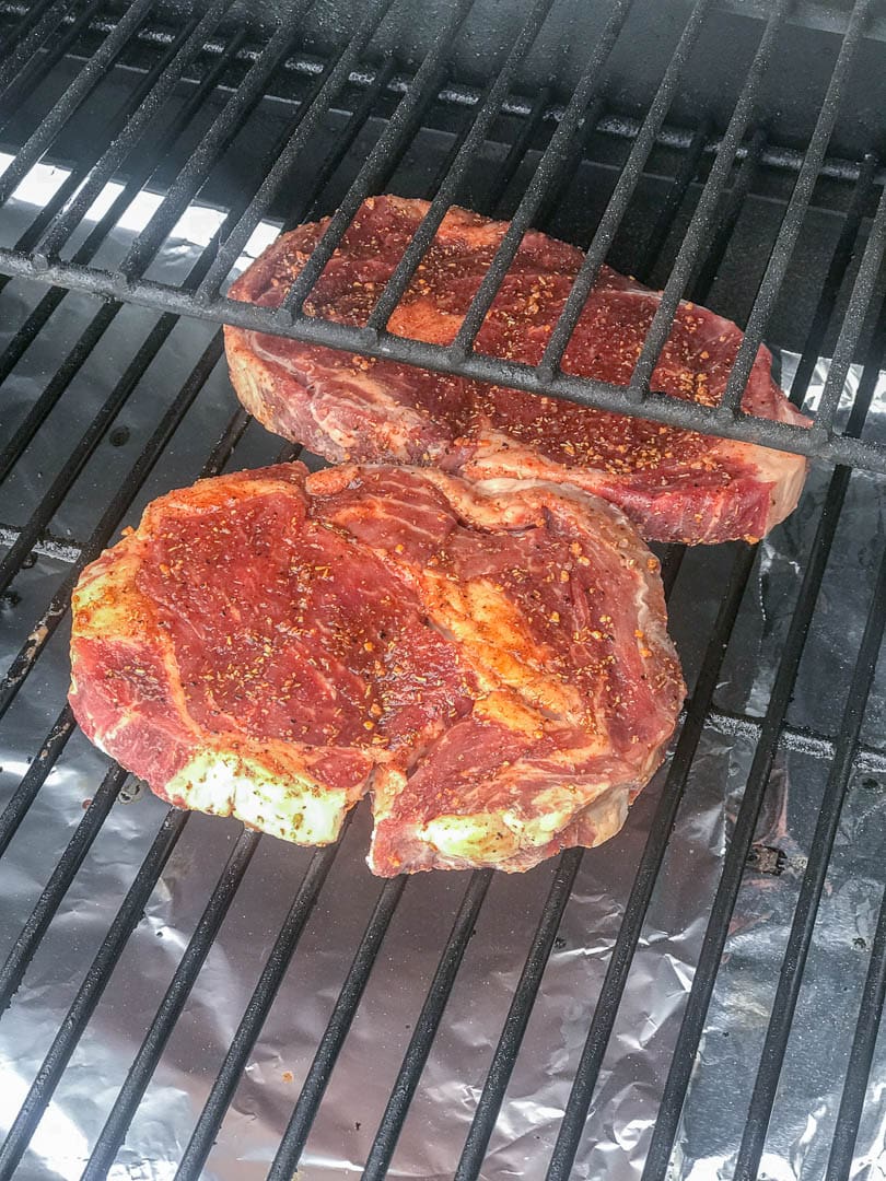 2 ribeye steaks on the grill