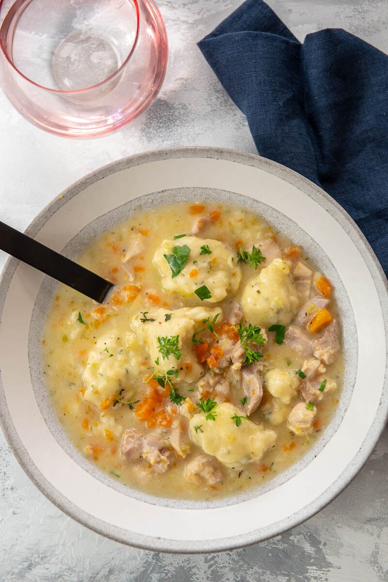 gray and white soup bowl with chicken and dumplings