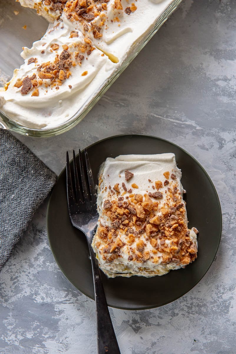 serving of icebox cake on plate next to casserole dish 