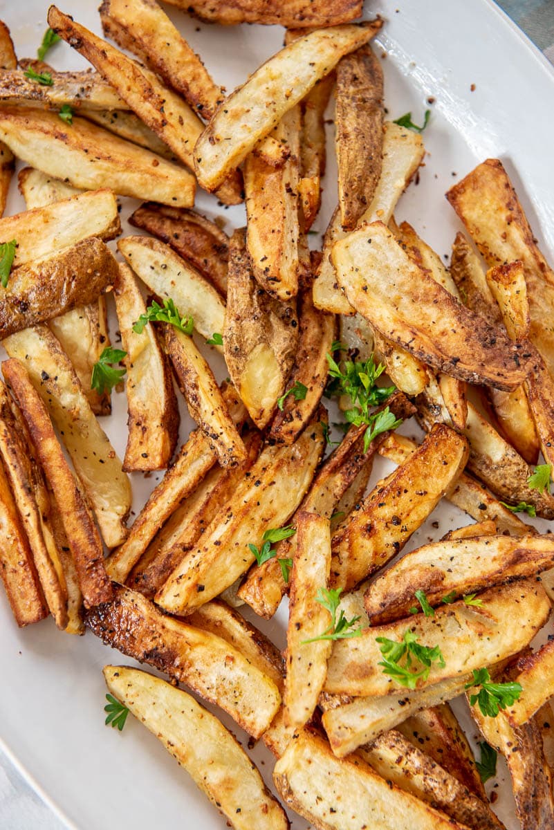 homemade French fries from the air fryer on a white platter
