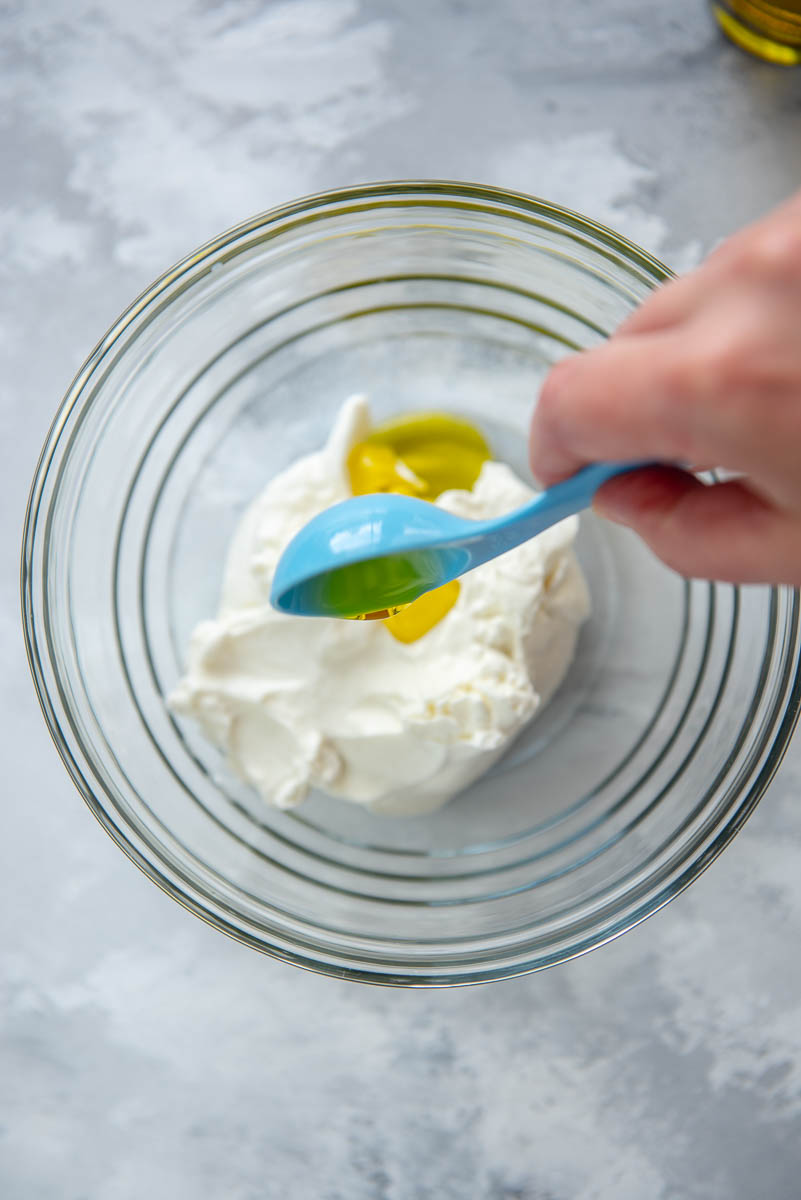 ingredients for yogurt sauce in glass bowl