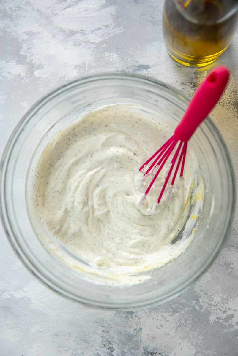 glass bowl and whisk for yogurt sauce