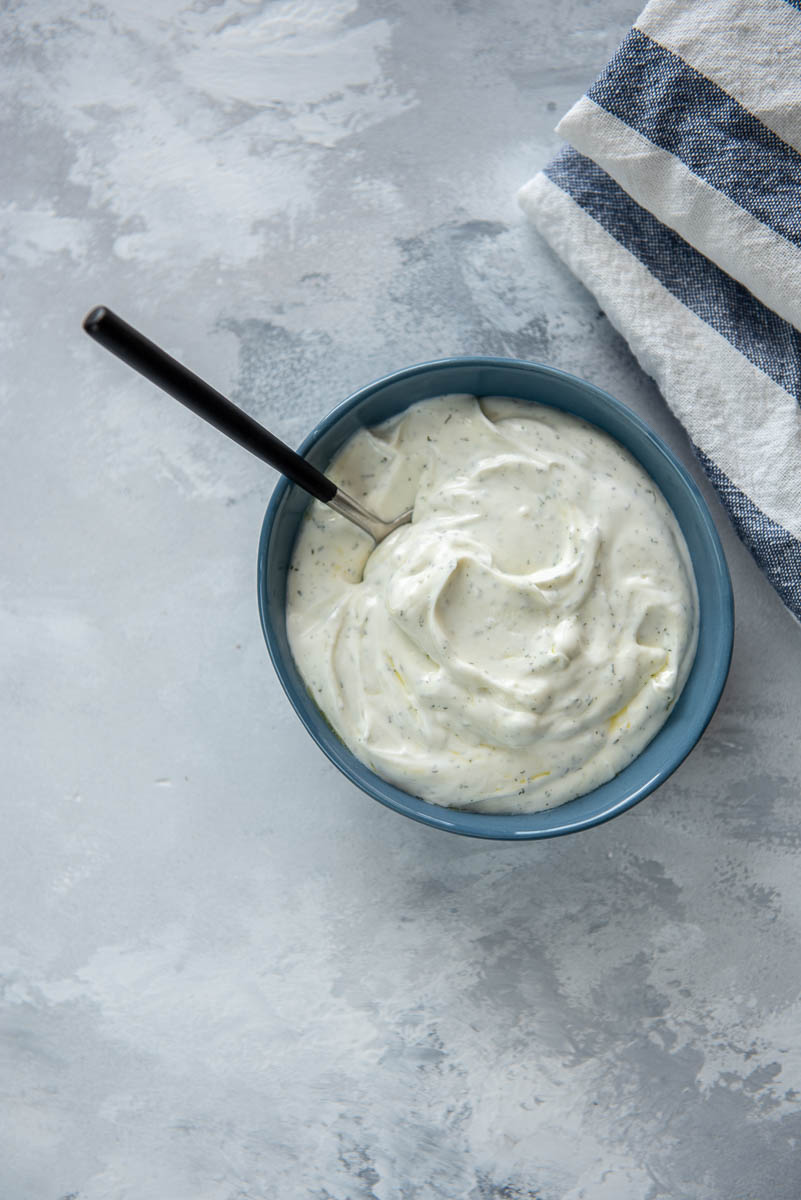 blue bowl filled with yogurt sauce