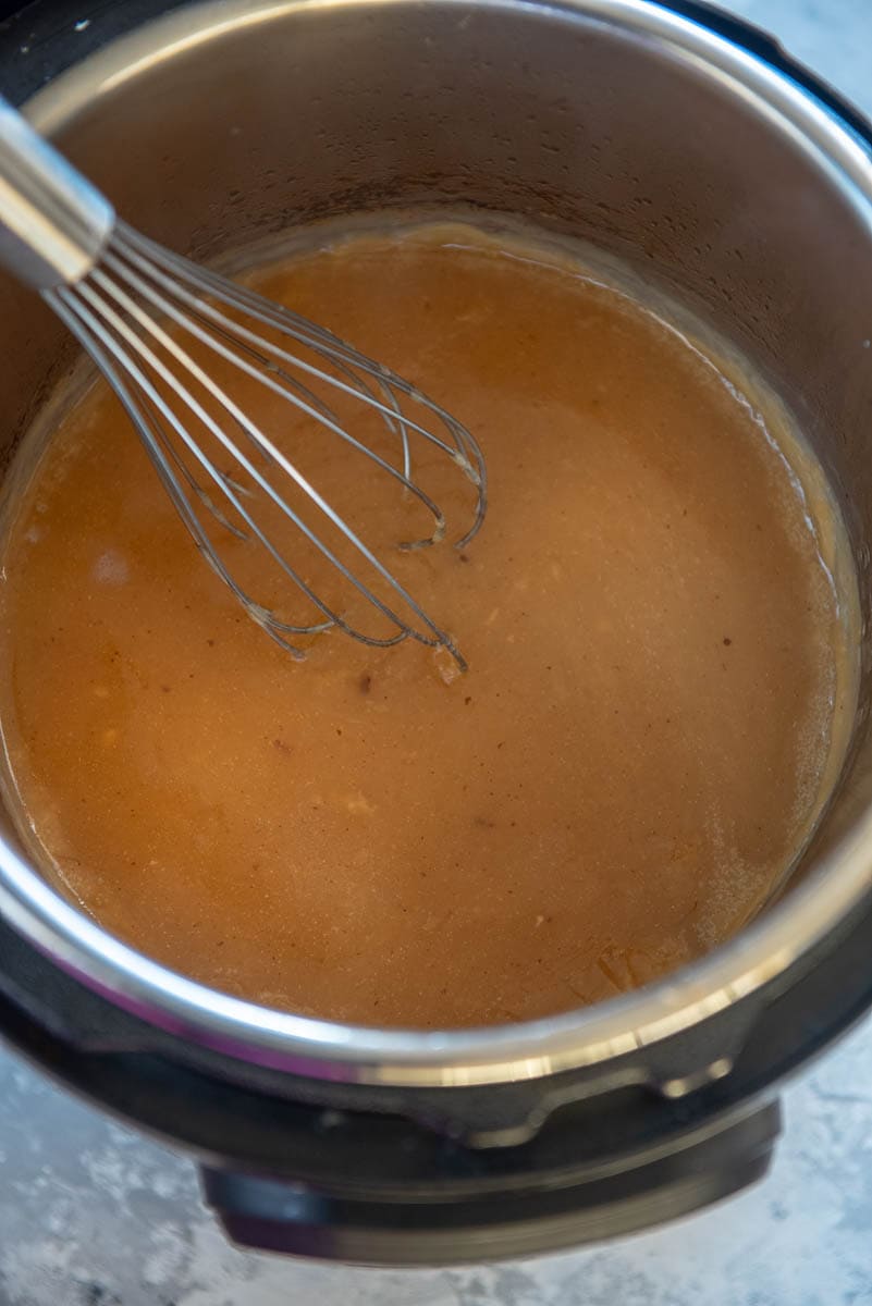 instant pot with gravy and whisk