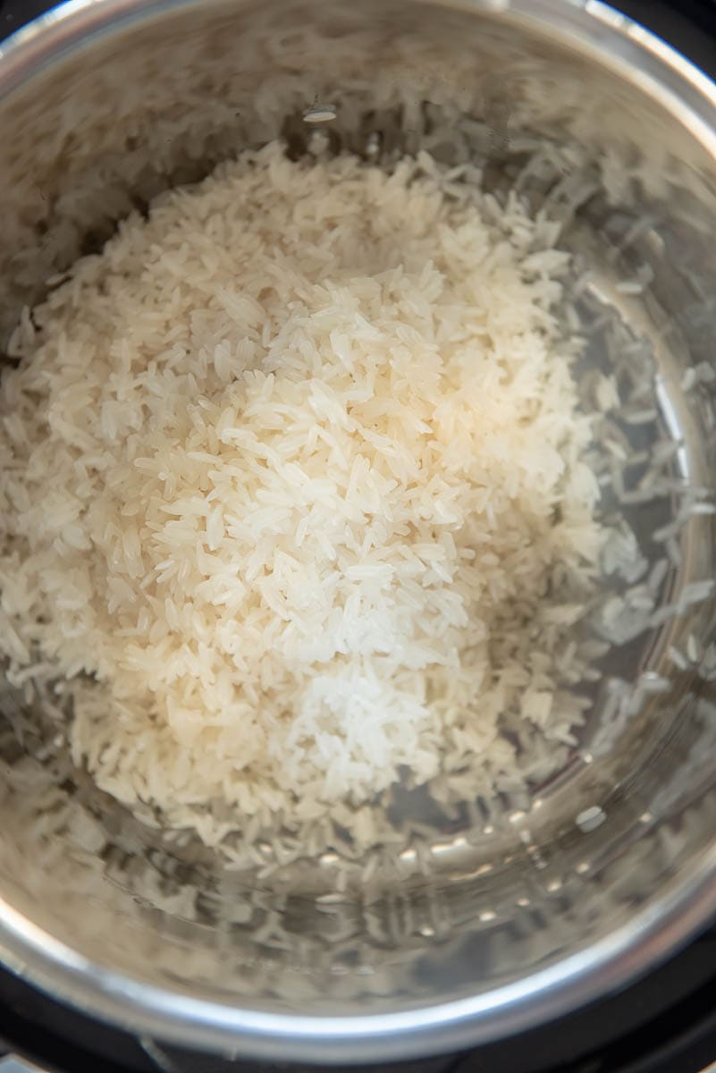 rice in the pot of the pressure cooker