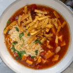 vegetarian soup in gray and white bowl