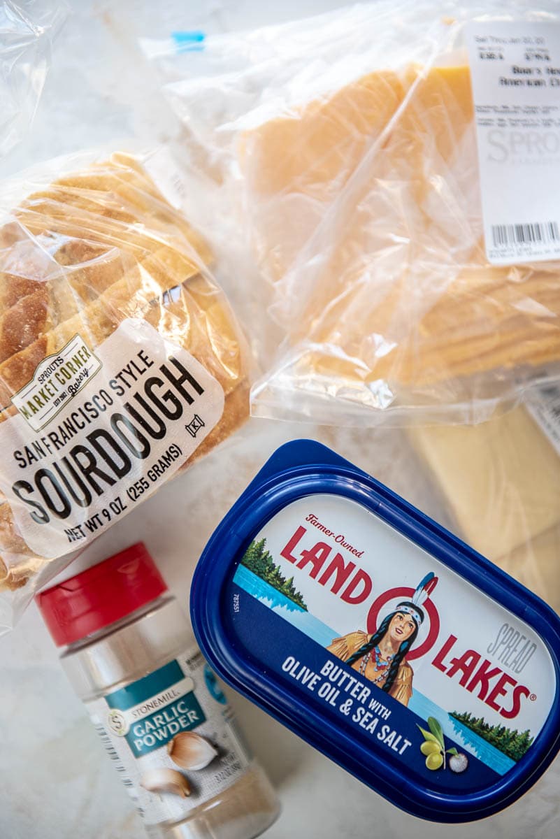 bread, cheese, garlic powder and butter to make grilled cheese sandwiches