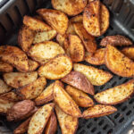 crispy potato wedges in air fryer basket