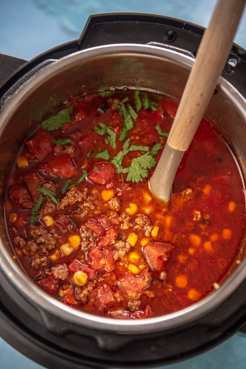 instant pot with taco soup and ladle