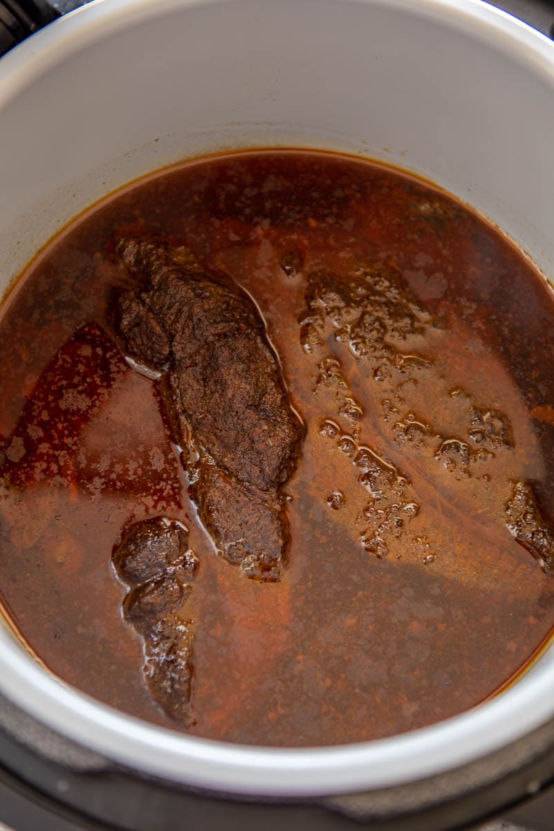 shredded beef simmering in instant pot