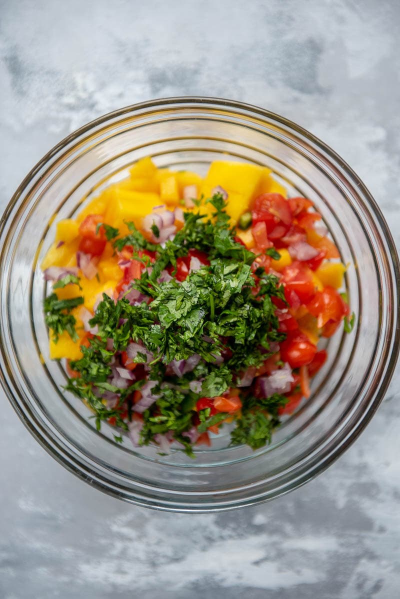 ingredients for mango salsa in a bowl