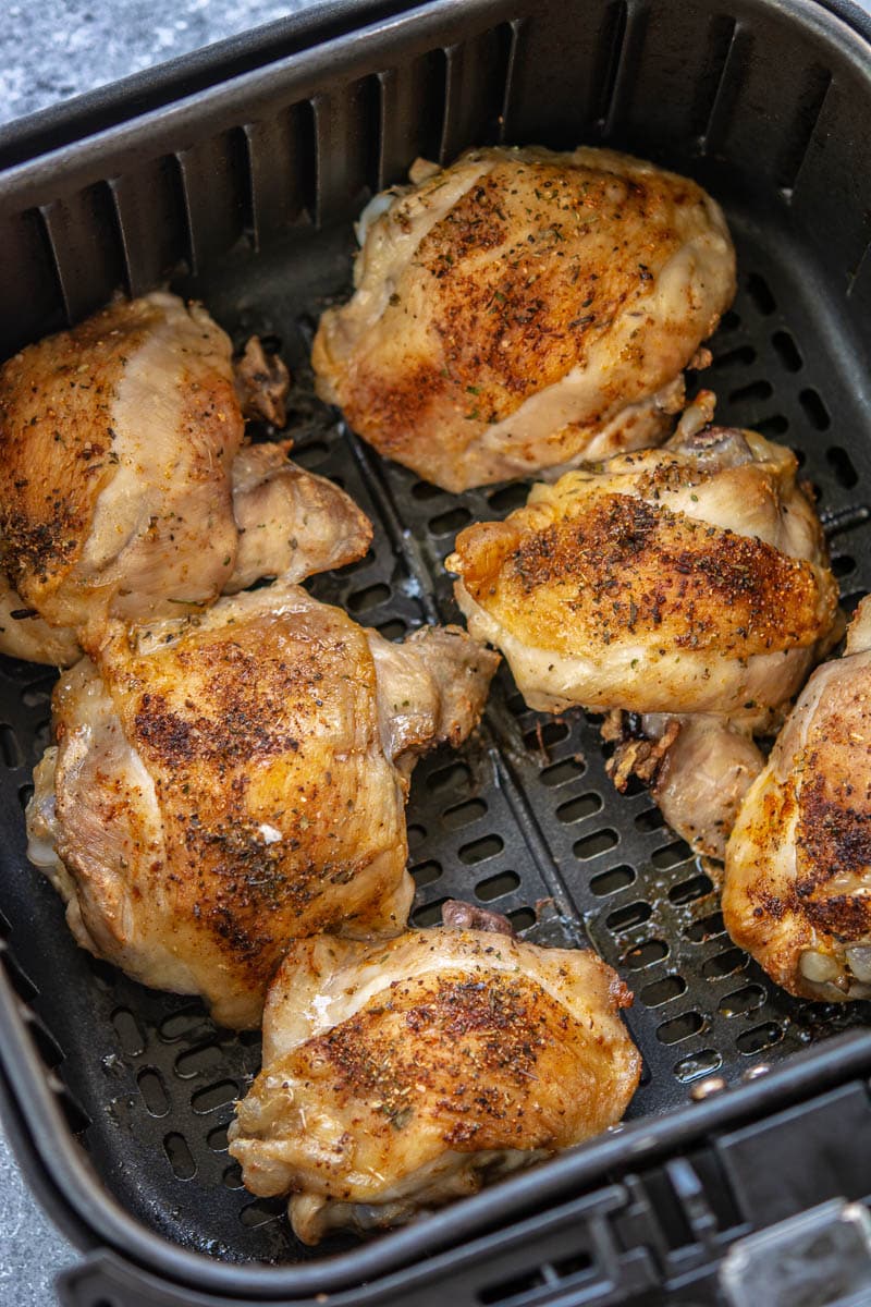 cooked chicken in an air fryer pan
