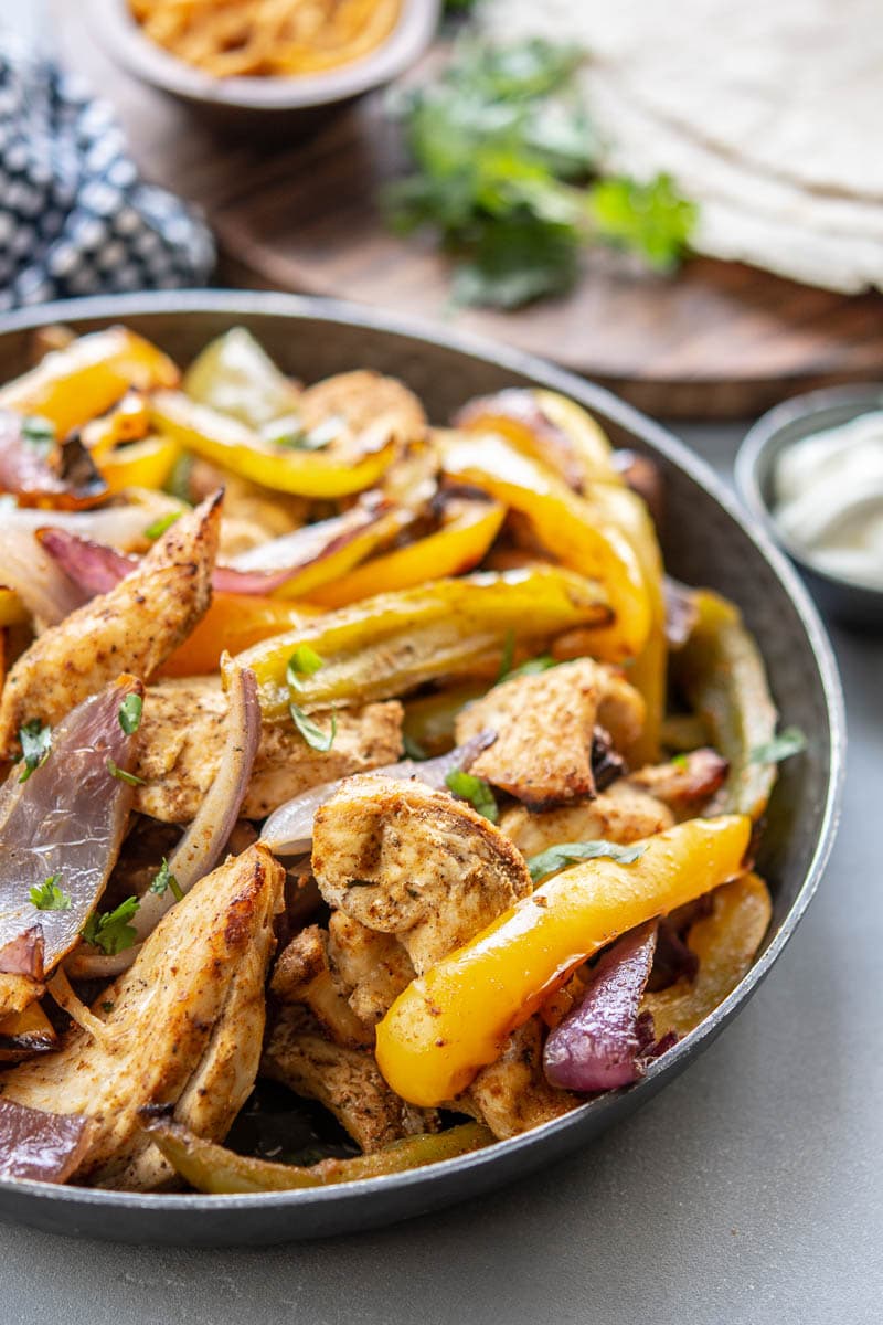 chicken fajitas in a cast iron skillet