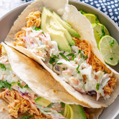 buffalo chicken tacos on a plate with garnish