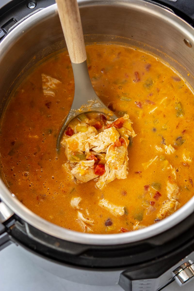 chicken fajita soup in an instant pot with a spoon