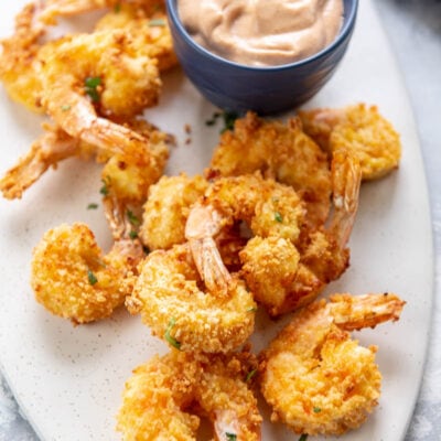 fried shrimp with sauce on a white plate