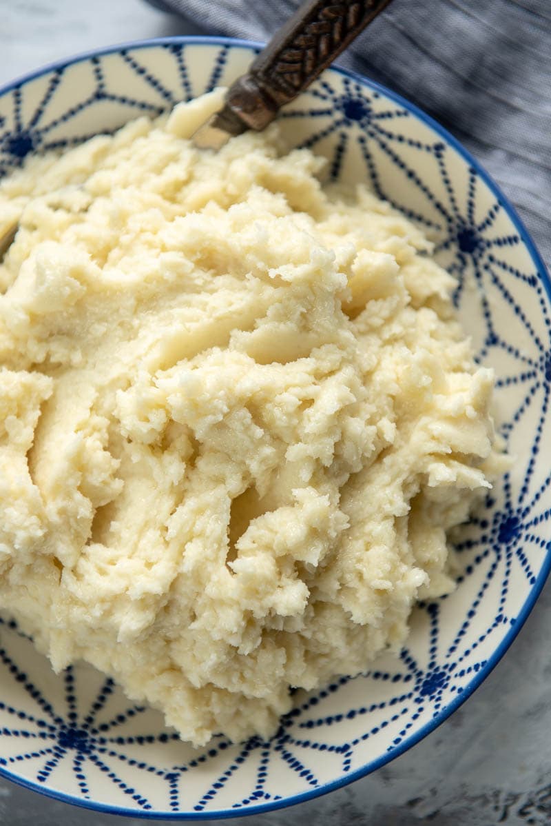 mashed potatoes in a bowl with spoon