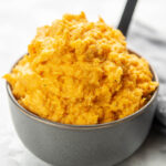 mashed sweet potatoes in a bowl with spoon