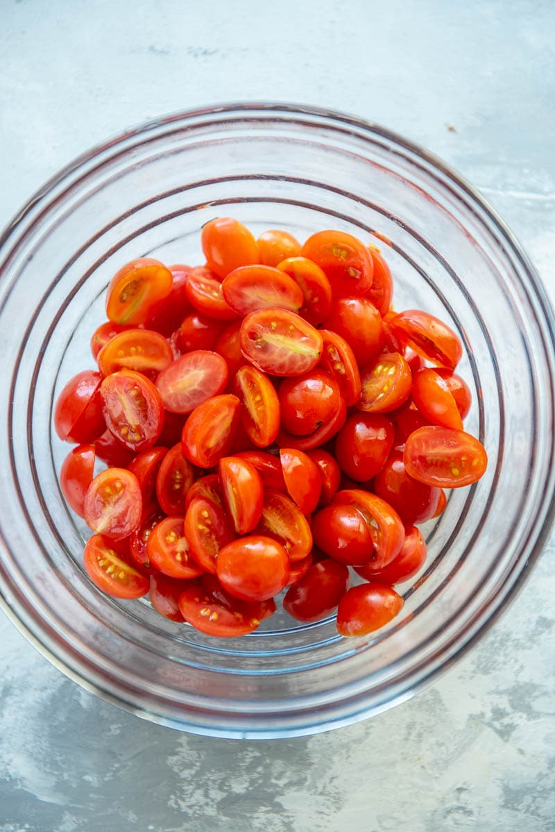 sliced grape tomatoes in a bowl