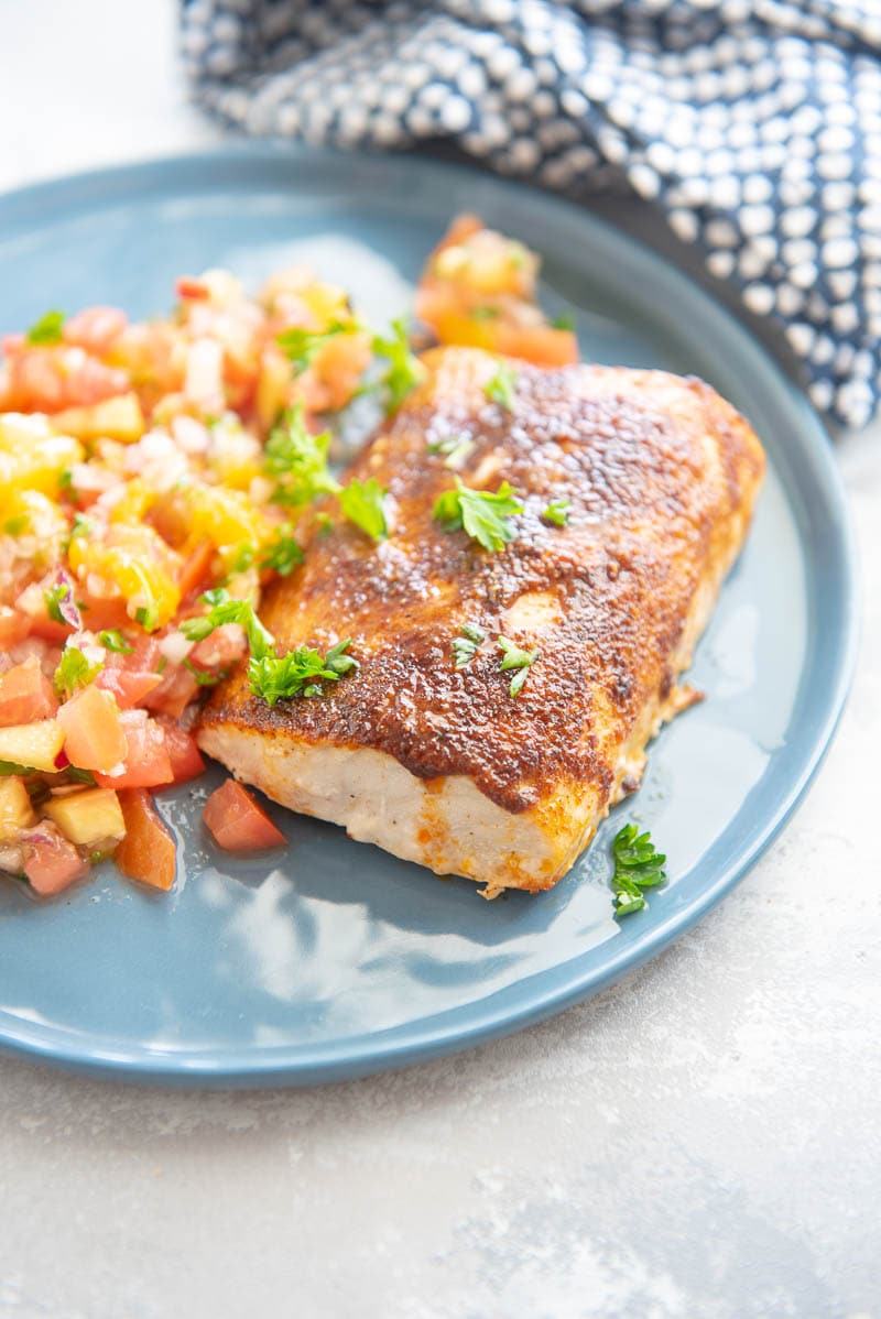 mahi mahi on a plate with garnish