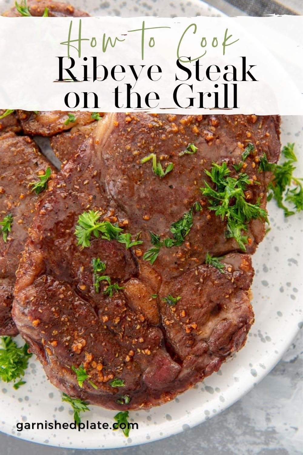How to Cook Ribeye Steak on the Grill Garnished Plate