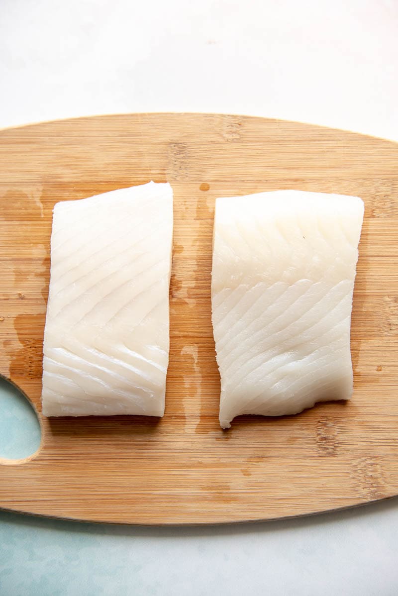 halibut fillets on a cutting board