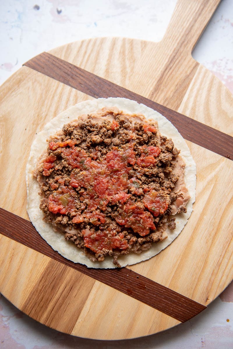 mexican pizza toppings on a tortilla