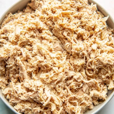 closeup of shredded chicken thighs in a bowl