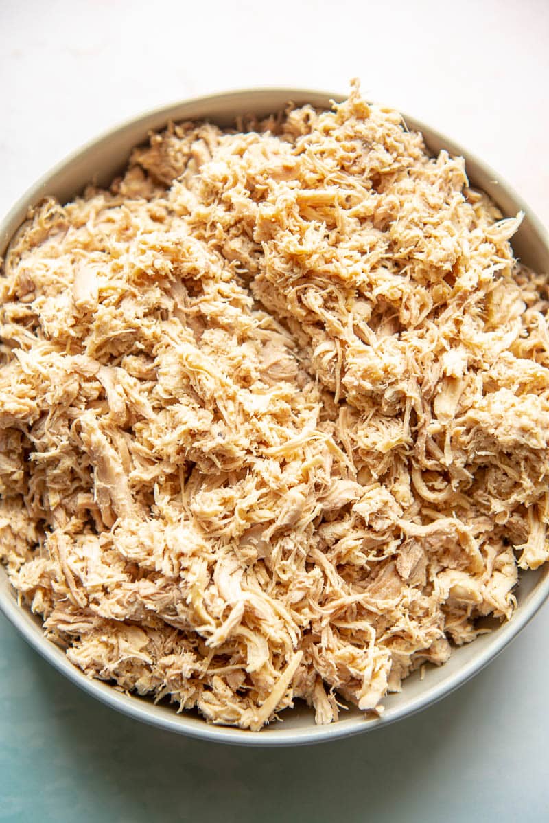 closeup of shredded chicken thighs in a bowl