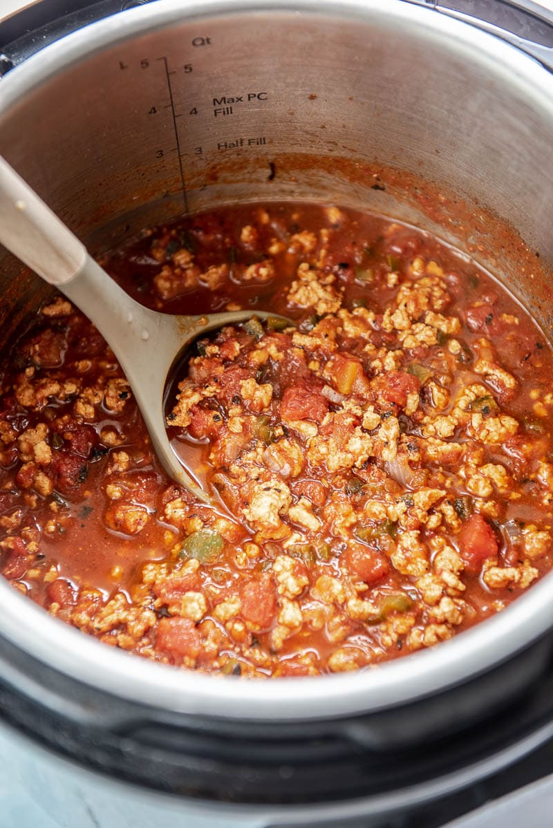 turkey chili in an instant pot with a spoon