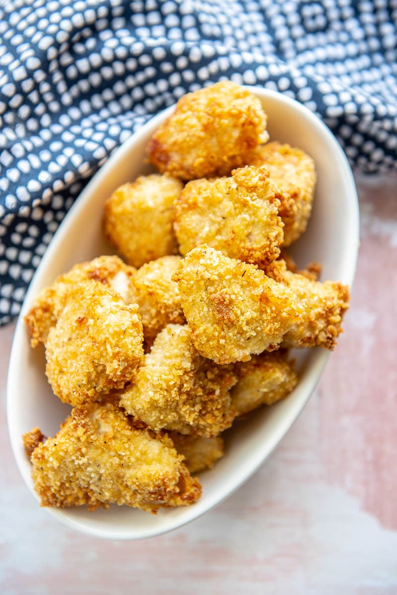 homemade chicken nuggets in white oval bowl